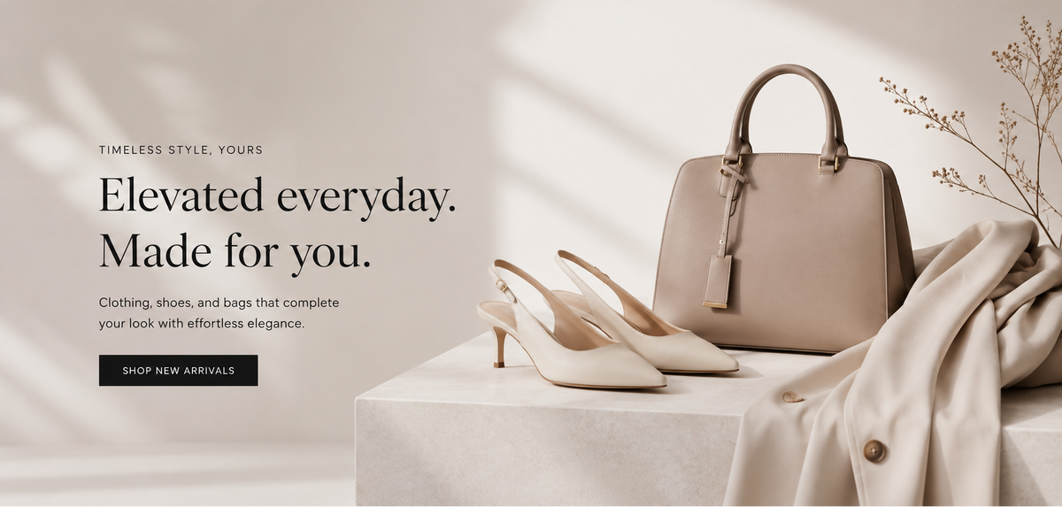 A luxury fashion storefront banner for AVERNELLE, featuring a taupe leather handbag, beige high-heeled shoes, and a draped cream silk scarf on a white pedestal with soft window shadows.
